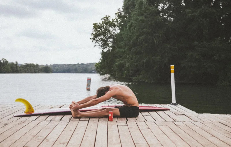 Stretching on a dock beside the lake
