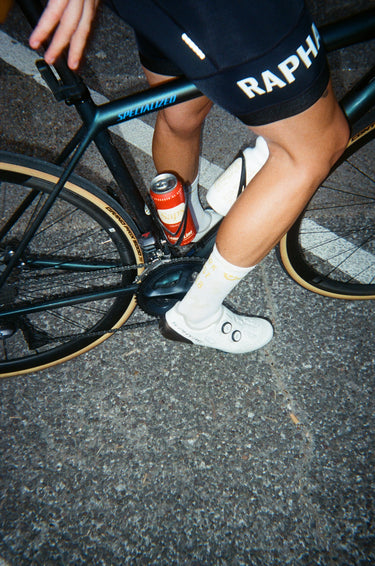 Can of Sap's in a water bottle holder on a mountain bike