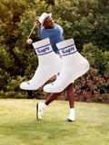 A stylized image showing a person playing golf wearing large white socks with the word 'Saps' written on them. The setting is a golf course with greenery in the background. #color_blue