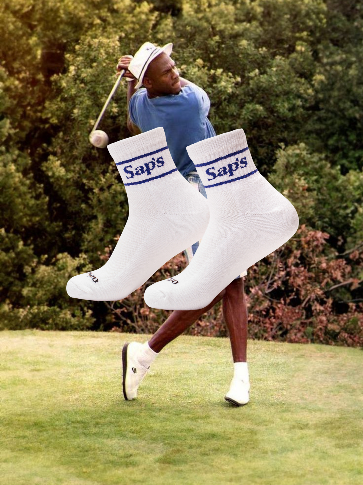 A stylized image showing a person playing golf wearing large white socks with the word 'Saps' written on them. The setting is a golf course with greenery in the background. #color_blue