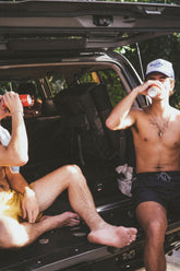 Two men enjoying Sap's at the lake